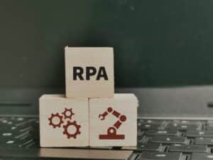 Concept of RPA Robotic process automation on wooden cubes.