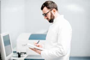 Technician working with analyzer machine